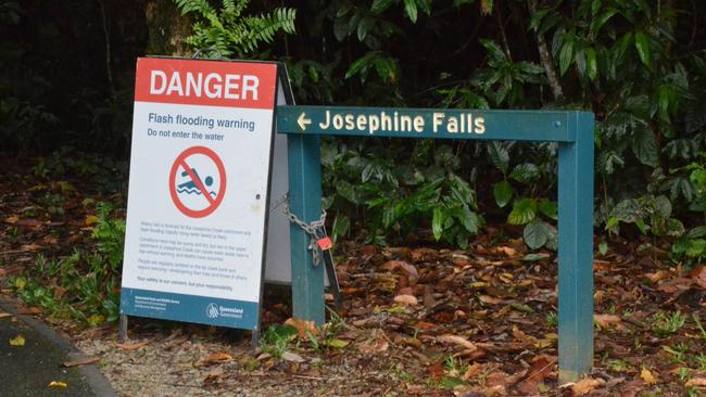 Signs at the entrance to Josephine Falls warn tourists of the dangers of rising floodwaters. Pic: ELISABETH CHAMPION