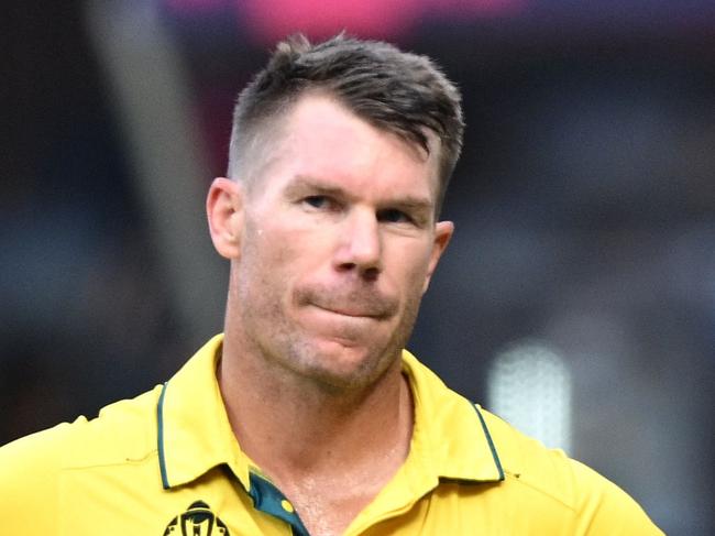 Australia's David Warner gestures to spectators as he walks back to the pavilion after his dismissal during the 2023 ICC Men's Cricket World Cup one-day international (ODI) match between Australia and Pakistan at the M. Chinnaswamy Stadium in Bengaluru on October 20, 2023. (Photo by R.Satish BABU / AFP) / -- IMAGE RESTRICTED TO EDITORIAL USE - STRICTLY NO COMMERCIAL USE --