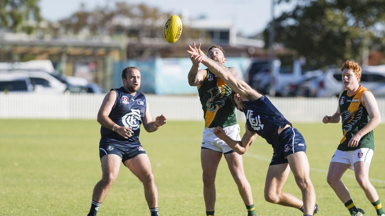 Goondiwindi Hawks player Tyson Hagiel (centre) against Coolaroo in AFL Darling Downs Allied Cup senior men grand final at Rockville Park, Saturday, September 2, 2023. Picture: Kevin Farmer