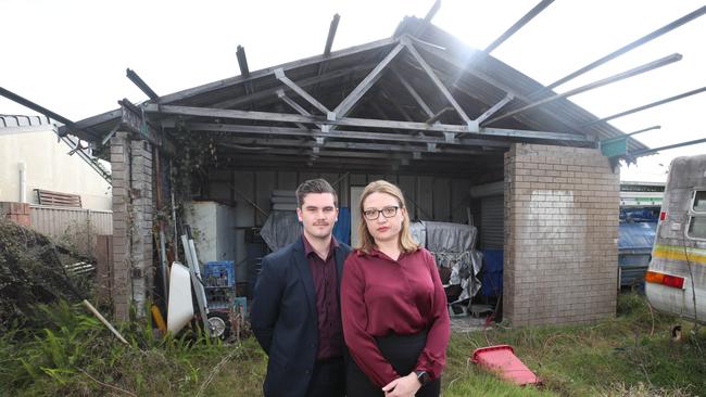 Real estate agents Kyle Judd and Yulia Far from Better Homes and Gardens Real Estate at the man’s Coombabah home. Picture: Glenn Hampson.