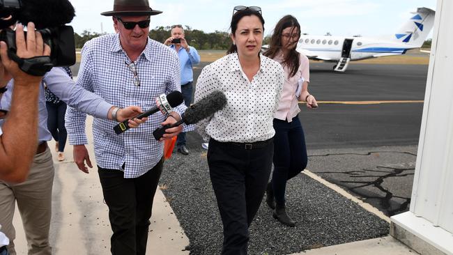 Queensland Premier Annastacia Palaszczuk mobbed by the media on arrival at Gladstone airport. Picture: AAP.