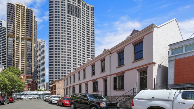 The terraces on Longs Lane in Sydney’s The Rocks, with the Quay West and Shangri-La buildings in the distance.