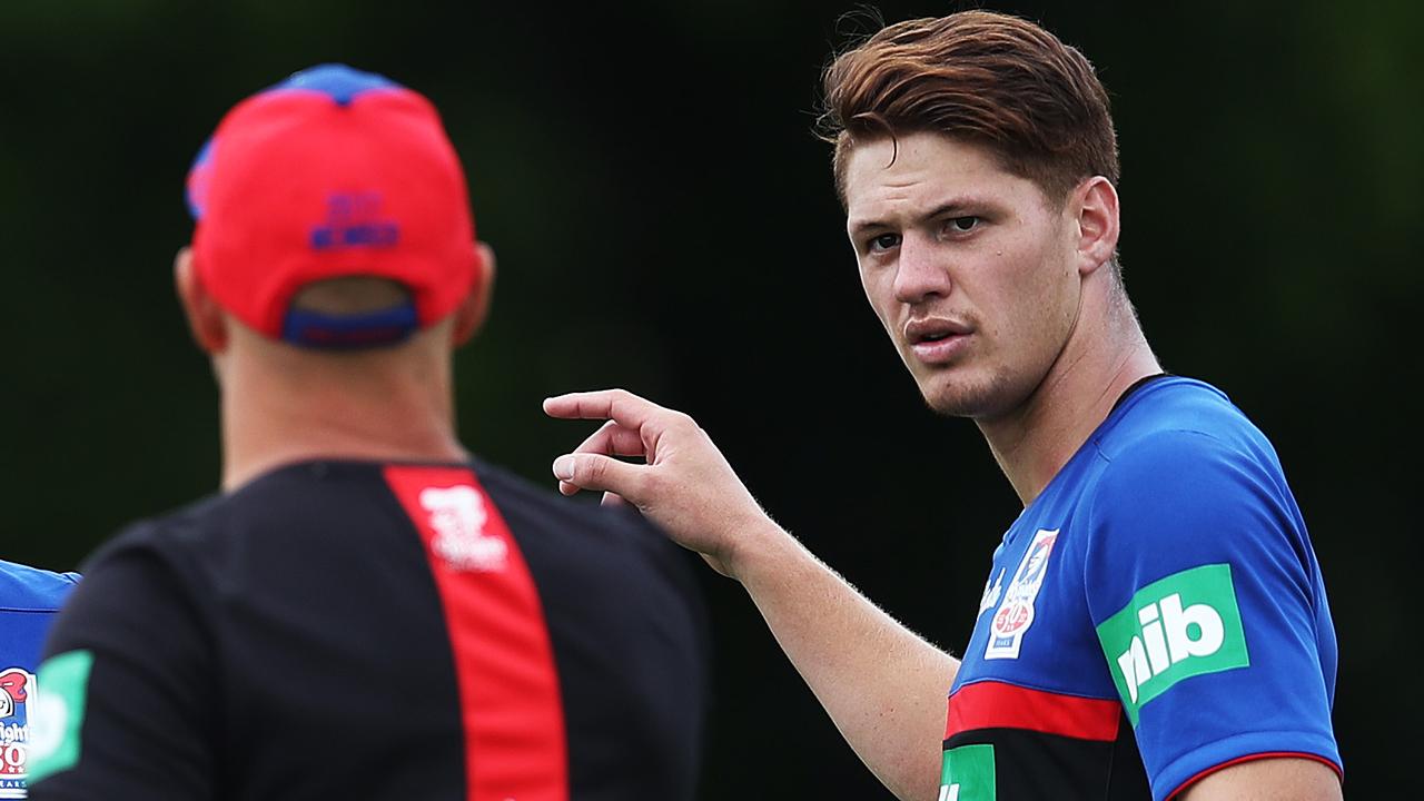 Kalyn Ponga chats with coach Nathan Brown during Newcastle Knights training.