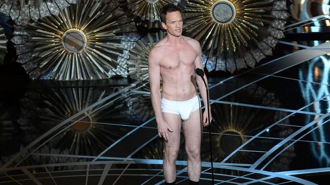 TOPSHOTS Host Neil Patrick Harris presents on screen at the 87th Oscars February 22, 2015 in Hollywood, California. AFP PHOTO / Robyn BECK