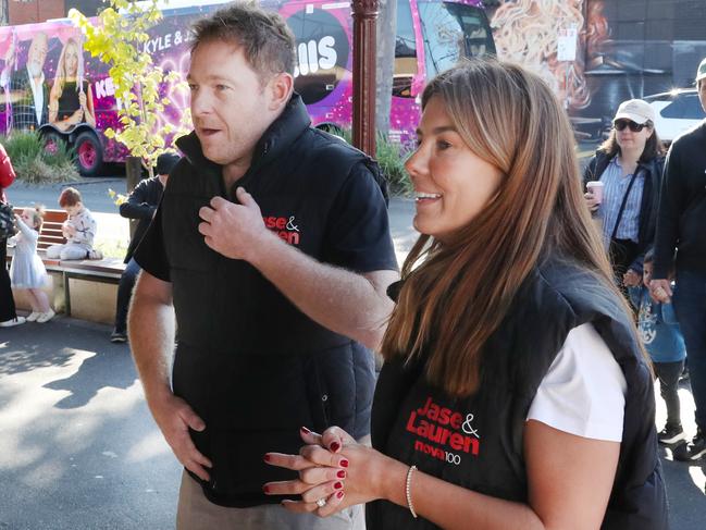 Lauren and Jase from Nova FM do a promotion at South Melbourne Market. Picture: David Crosling