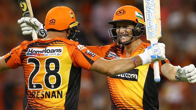 Adam Voges and Tim Bresnan celebrate the Scorchers’ four-wicket win over the Strikers on Thursday night. Photo: Paul Kane