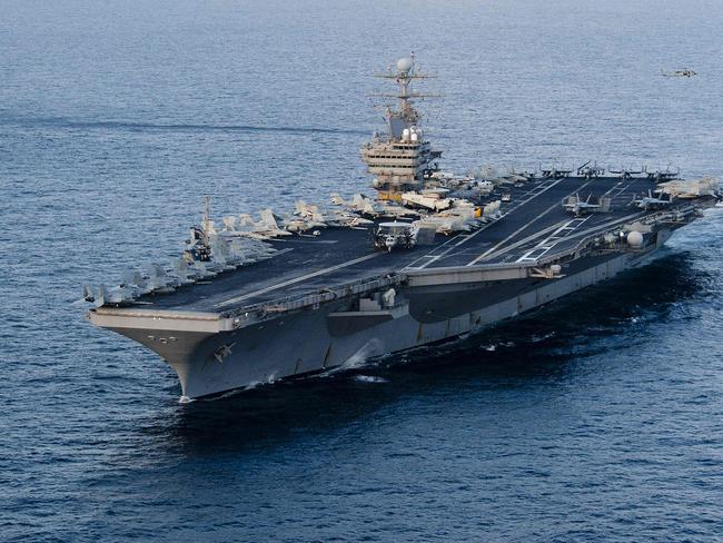 (FILES) This January 19, 2012 image provided by the US Navy, shows the Nimitz-class aircraft carrier USS Abraham Lincoln transiting the Arabian Sea. The US will bolster its military presence in the Middle East, deploying additional warships and fighter jets to protect US personnel and defend Israel amid soaring tensions in the region, the Pentagon said on August 2, 2024. The aircraft carrier strike group led by the USS Abraham Lincoln will replace one helmed by the USS Theodore Roosevelt in the region, deputy Pentagon Press Secretary Sabrina Singh said. (Photo by Will Tyndall / US NAVY / AFP) / RESTRICTED TO EDITORIAL USE - MANDATORY CREDIT "AFP PHOTO / US NAVY/Mass Communication Specialist 3rd Class/Will Tyndall " - NO MARKETING NO ADVERTISING CAMPAIGNS - DISTRIBUTED AS A SERVICE TO CLIENTS