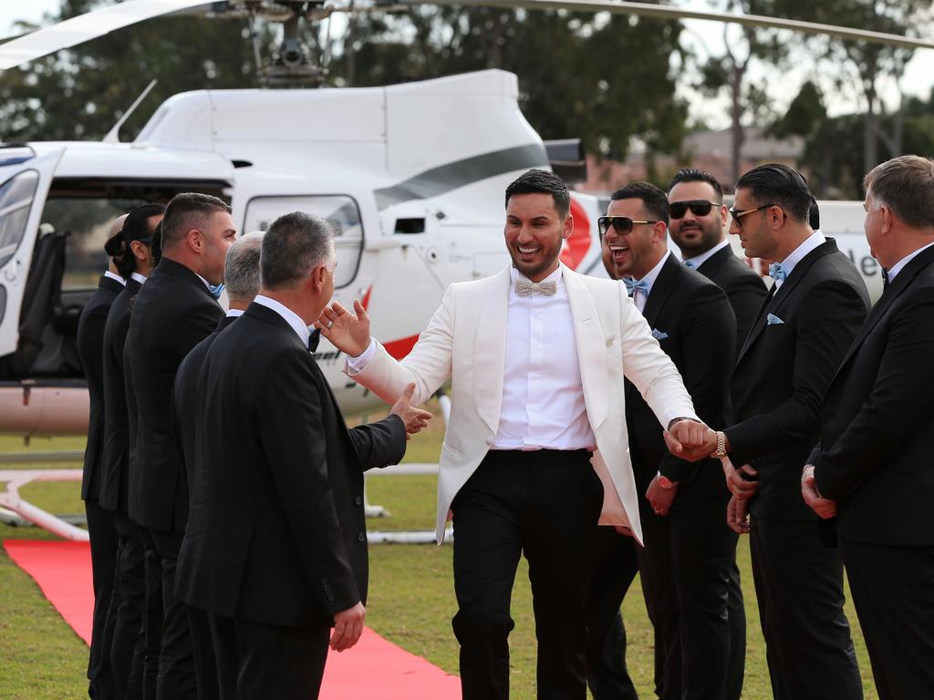 Mehajer os greeted by his groomsment on the red carpet after flying in by helicopter. Picture: Toby Zerna