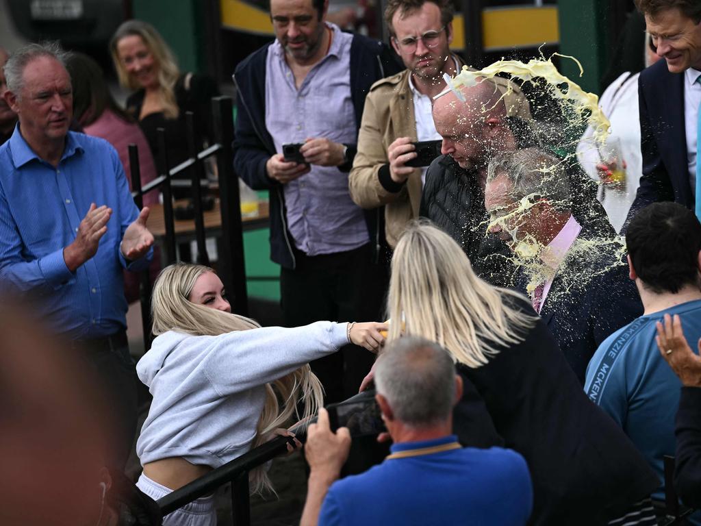 A person throws a drink in the face of newly appointed leader of Britain’s right-wing populist party, Reform UK, and the party’s parliamentary candidate for Clacton, Nigel Farage, during his general election campaign launch in Clacton-on-Sea, eastern England, on June 4, 2024. Picture: AFP