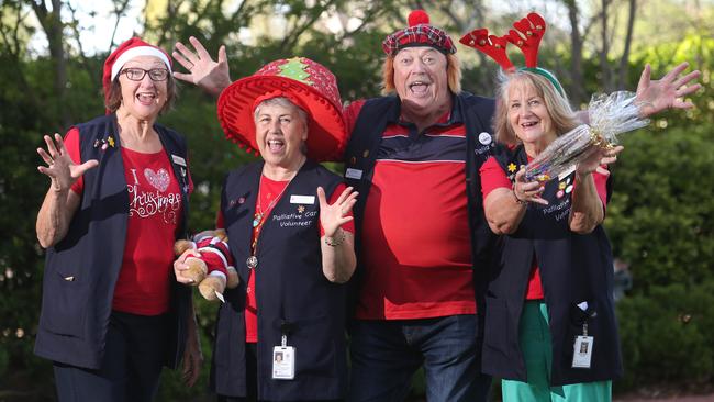 Volunteers Kerry Wheatley, Carmen Pecorari, Robert Stewart and Sandra Wales call for the community to support their Christmas stall. Picture: Robert Pozo