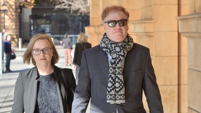 ATO whistleblower Richard Boyle with his partner outside the South Australian Supreme Court. Picture: Brenton Edwards