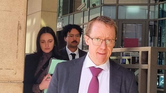 Koshin-Connor Ibrahim (centre), with his lawyer Patrick J Doyle (right), declined to comment on the case outside court. Picture: Liam Beatty/ NCA NewsWire