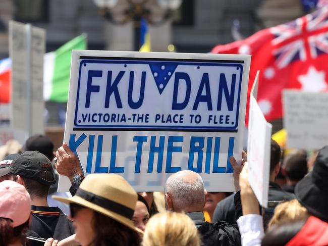 Anti government protesters have gathered in Bourke St before they march across the CBD. Picture: Ian Currie