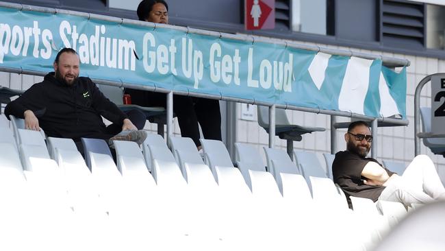 Hamdi Alameddine (left) casts an eye over a schoolboy footy game at Campbelltown Sports Stadium.