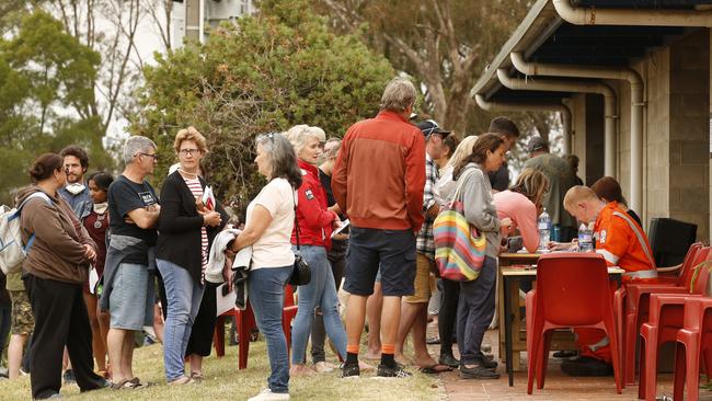 Mallacoota Fires. Residents and holiday makers line up to sign up for evacuation on HMAS Choules. Picture: David Caird