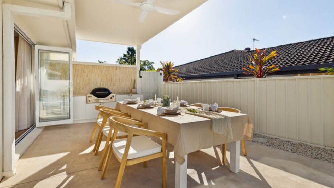 The al fresco dining area has a built-in barbecue