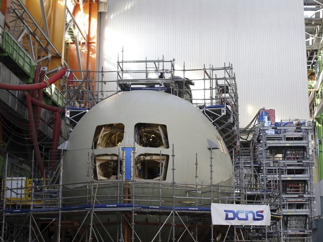 Australian engineers are already working at the secure facility at the start of what will be a 30-year project. Picture: AP Photo/Thibault Camus