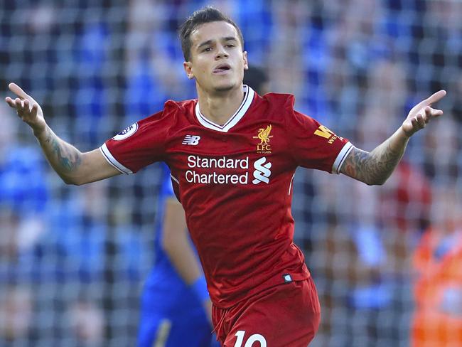 Liverpool's Philippe Coutinho, left, celebrates scoring his side's second goal of the game during the Premier League soccer match. Leicester City versus Liverpool at the King Power Stadium, Leicester, England,  Saturday Sept. 23, 2017. (Mike Egerton/PA via AP)