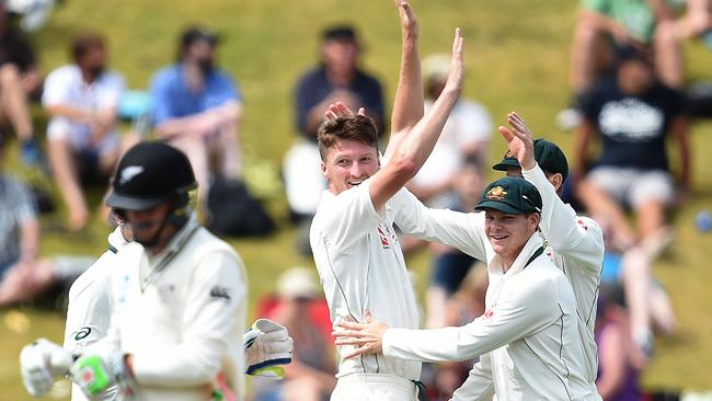 Jackson Bird and Steve Smith celebrate the wicket of Henry Nicholls.