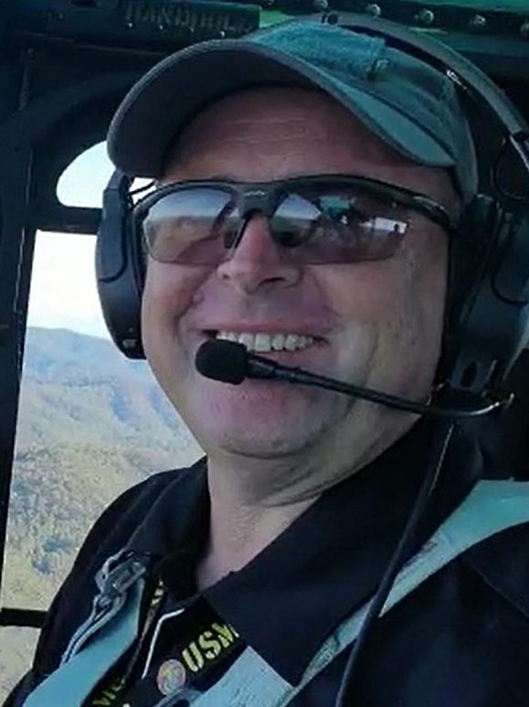 Pilot David Kerr in his UH-1H helicopter before it crashed into the sea.