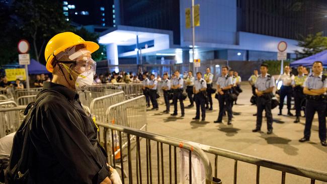 Security forces keep an eye on a student protest in Hong Kong. Picture: Jayne Russell