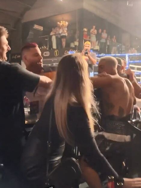 Former MAFS contestants Bryce Ruthven (left) and Sam Carraro (right) were filmed lunging at one another outside the ring at the Team Ellis boxing event in Melbourne on Friday. Ruthven’s fiancee Melissa Rawson (centre) was injured.