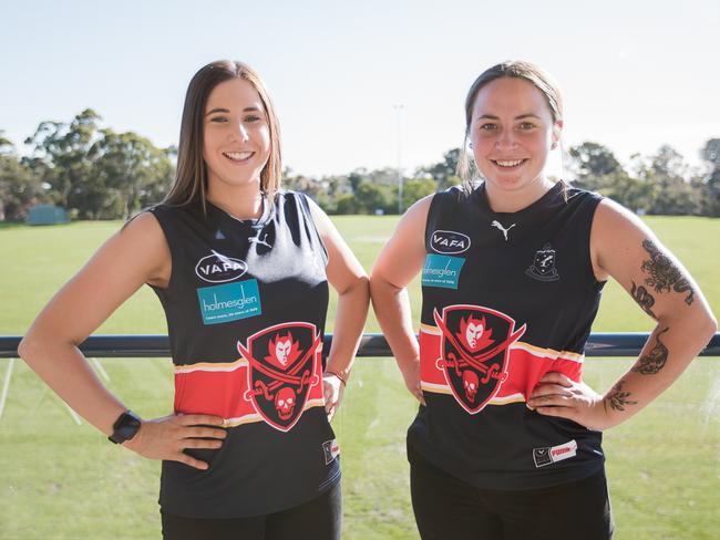 Emily Marriott (left) and Shiela Dunkley show off the new Peninsula women’s side’s jumper. Picture: Jimmy’s Projects.