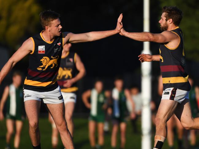 Doncaster East team mates celebrate after a goal during the EFL Division two match at Walker Reserve, Wantirna South, Melbourne, Saturday, May 26, 2018. Wantirna Sth v Doncaster East. (AAP Image/James Ross) NO ARCHIVING