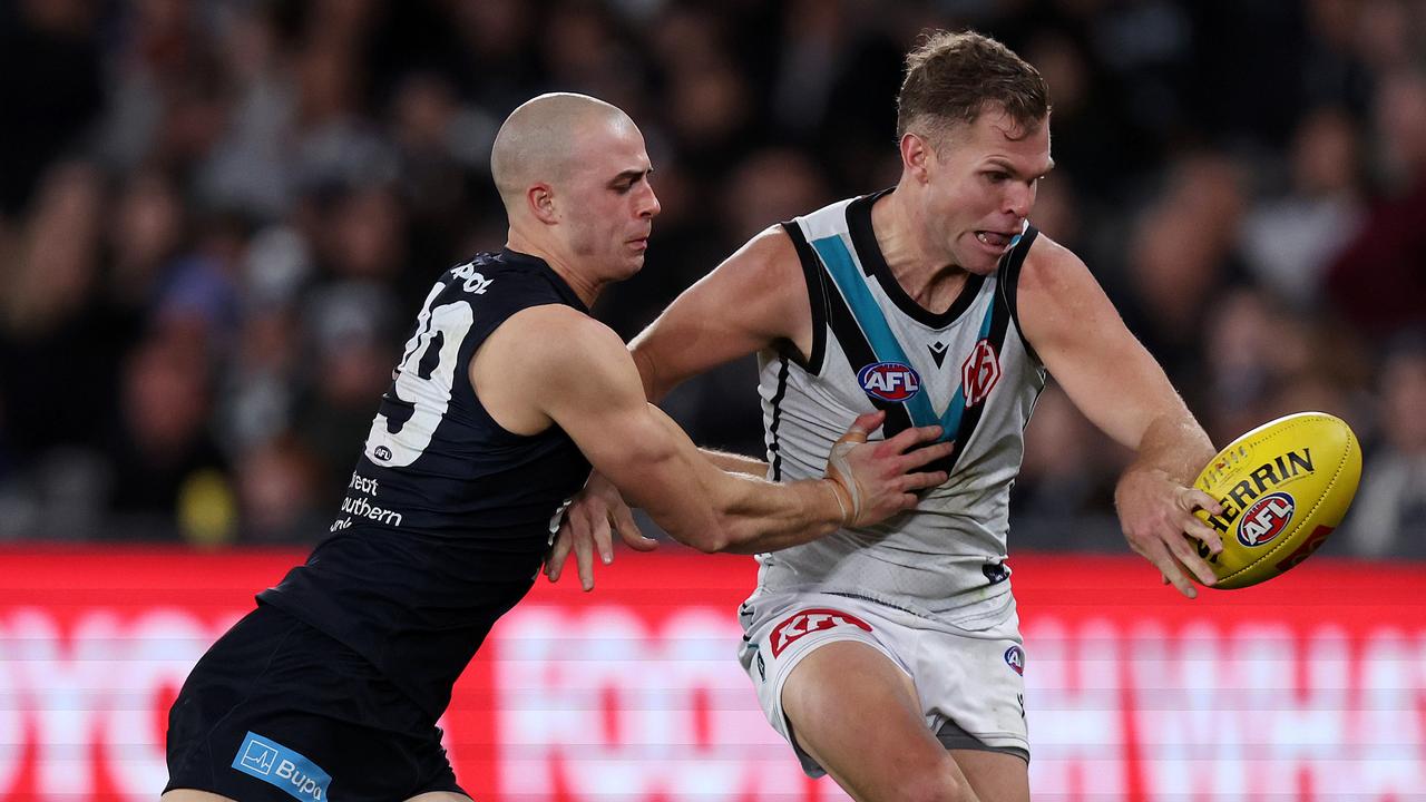 Carlton has been linked to Victorian and Port Adelaide defender Dan Houston (right). Picture: Mark Stewart