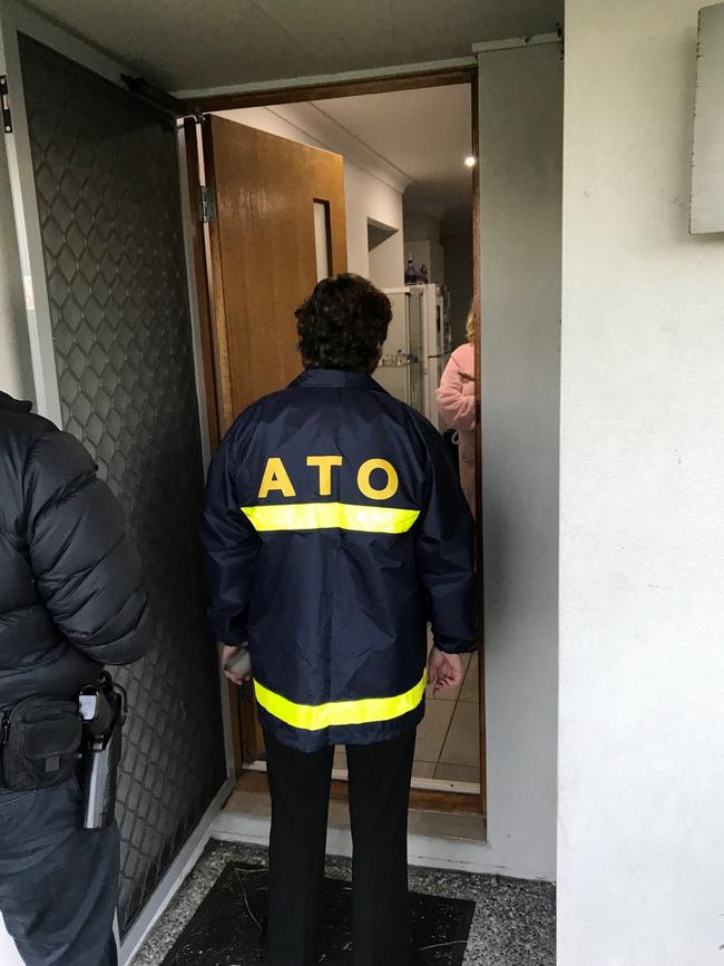 Australian Taxation Office investigators conducting raids on six individuals in Adelaide in connection with the Operation Protego GST refund scam. Picture: ATO