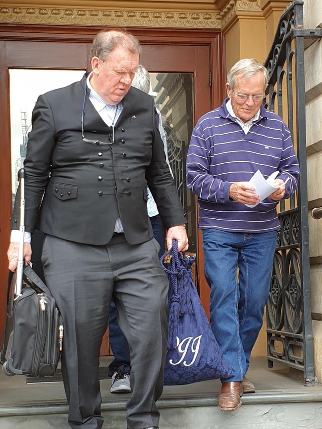 Marina St Vincent berth owner Trevor Gadd, right, and lawyer Peter Pedler leave the Supreme Court after Justice Trish Kelly found the State Government had lawfully terminated lease of the marina's operator. Picture: Renato Castello