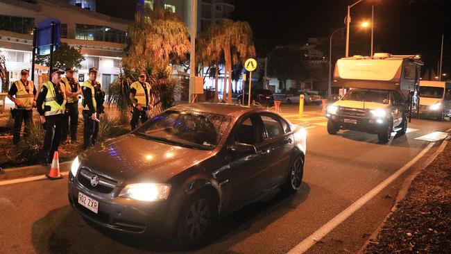 Queensland police welcome travellers into Queensland after the border closure was lifted at 1am. Picture: Scott Powick.