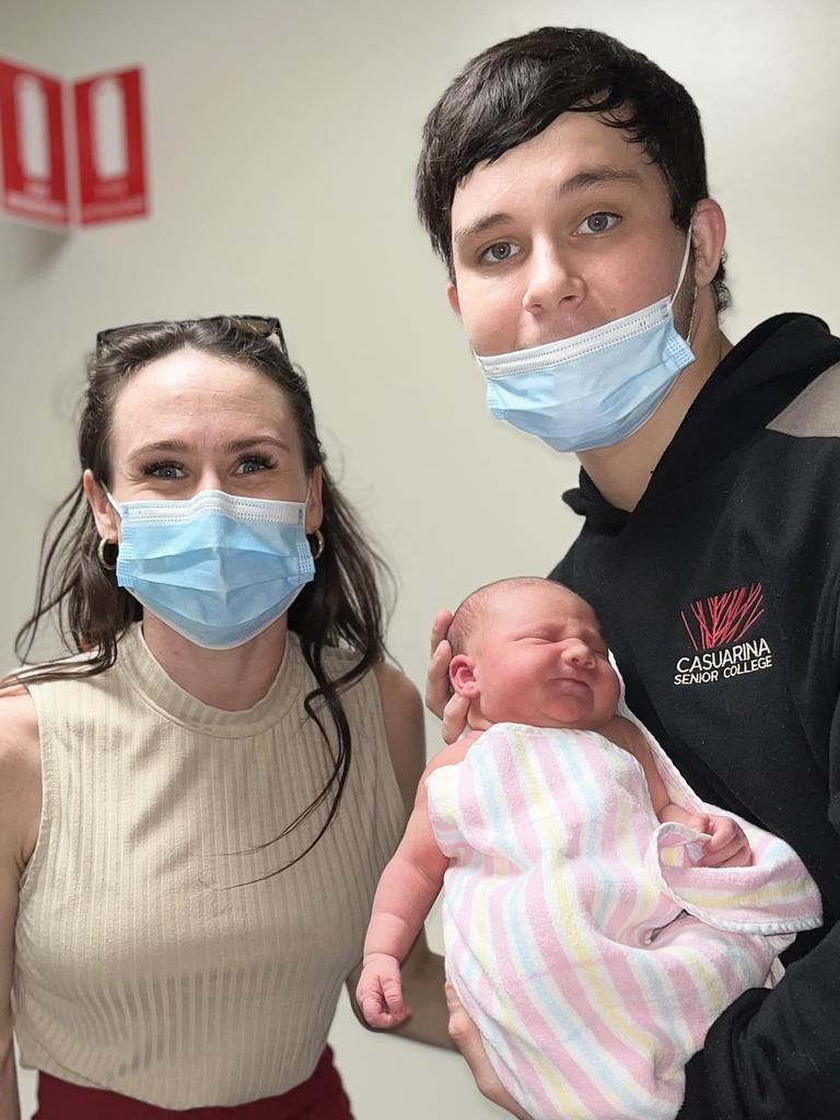 18-year-old Kingsley 'Junior' Alley holding his newborn daughter Eleanor, with stepmum Kylie Simmonds. Kingsley was allegedly murdered at Palmerston on October 8, 2022.