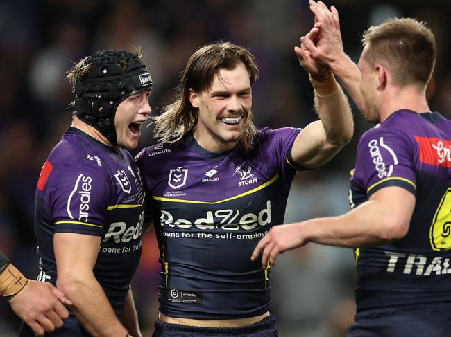 MELBOURNE, AUSTRALIA - SEPTEMBER 27:  Ryan Papenhuyzen of the Storm celebrates with team mates after scoring a try during the NRL Preliminary Final match between the Melbourne Storm and Sydney Roosters at AAMI Park on September 27, 2024 in Melbourne, Australia. (Photo by Cameron Spencer/Getty Images)