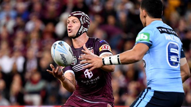 Kalyn Ponga offloads for the Maroons during Game One this year. Picture: AAP Image/Dave Hunt