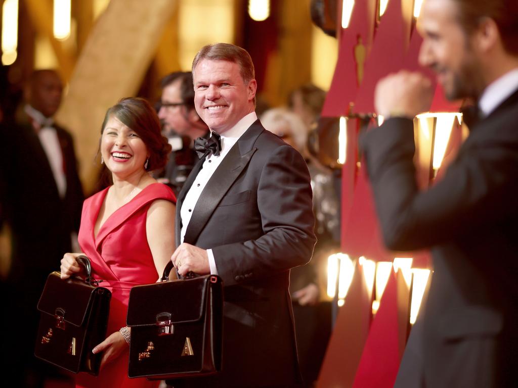 Representatives from PricewaterhouseCoopers, Martha L. Ruiz, Brian Cullinan with the Oscar winners in locked briefcases and actor Ryan Gosling pose on the red carpet at 89th Annual Academy Awards California. Picture: Getty