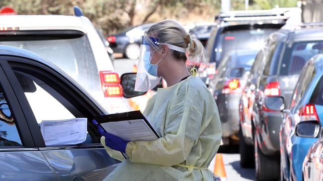 A health worker carries out COVID-19 testing at the Joondalup drive-through clinic in Perth on Monday. Picture: Paul Kane/Getty Images