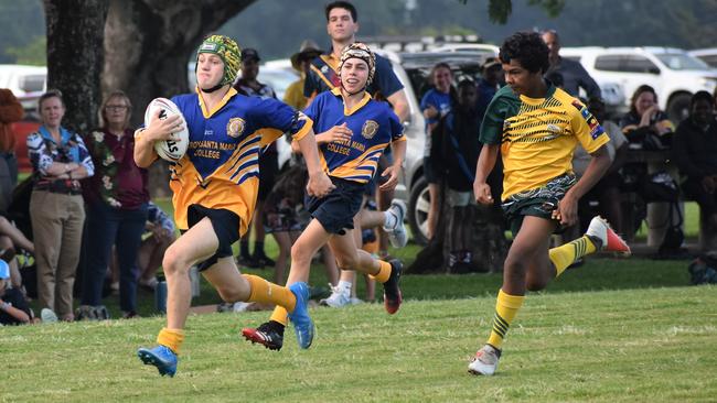 Kelin Corradi, Gilroy, on his way to score. Photographs from the Will Murdoch Perpetual Shield. The annual U14 rugby league competition, in its second year, involved Gilroy Santa Maria College, Ingham State High School and St Teresa's Catholic College Abergowrie. Picture: Cameron Bates