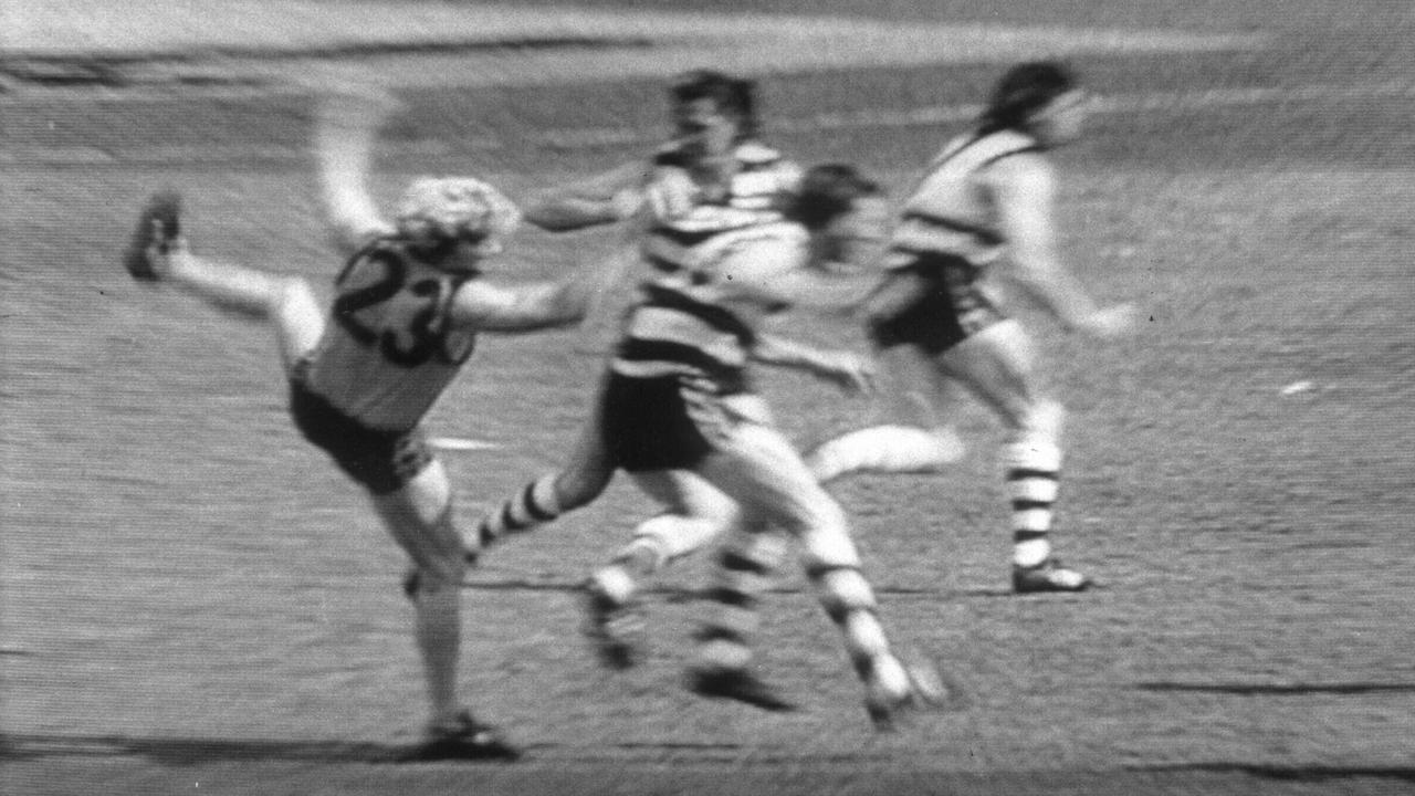 28/04/1999 PIRATE: Dermott Brereton is crunched by Mark Yeates at the opening bounce. 1989 Grand Final. Hawthorn v Geelong. MCG.