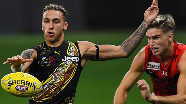 PERTH, AUSTRALIA - JUNE 05: Shai Bolton of the Tigers sets to kick on goal during the 2021 AFL Round 12 match between the Essendon Bombers and the Richmond Tigers at Optus Stadium on June 5, 2021 in Perth, Australia. (Photo by Daniel Carson/AFL Photos via Getty Images)