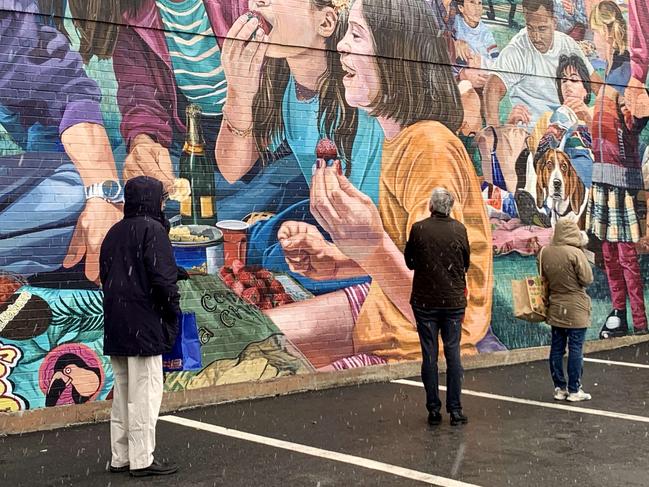 Shoppers wait in line outside of Trader Joe’s in Cambridge, Massachusetts, which has begun limiting the capacity of shoppers allowed inside. Picture: Maddie Meyer/Getty