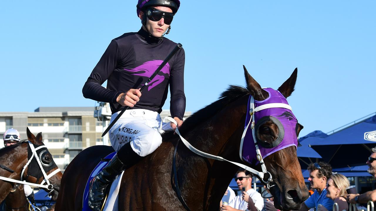 Justin Huxtable returns to scale on Boomtown Lass after winning at Doomben. Picture: Trackside Photography