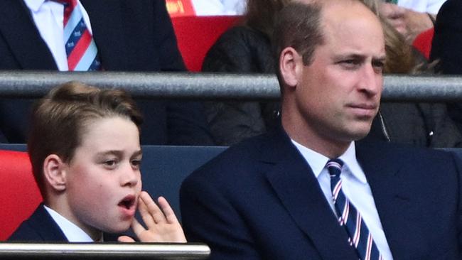 Britain's Prince George of Wales (L) and Britain's Prince William, Prince of Wales attend the English FA Cup final football match between Manchester City and Manchester United at Wembley stadium, in London, on May 25, 2024. (Photo by JUSTIN TALLIS / AFP) / NOT FOR MARKETING OR ADVERTISING USE / RESTRICTED TO EDITORIAL USE