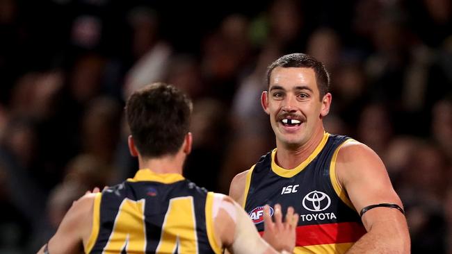 Crows Lachlan Murphy and Taylor Walker celebrate a goal Saturday’s win over St Kilda at Adelaide Oval. Picture: James Elsby/AFL Photos via Getty Images