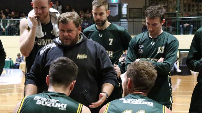 Ipswich Basketball president and Ipswich Force head coach Chris Riches reviews his team's position in an NBL1 North match at JBS Stadium. Picture: Megan Low