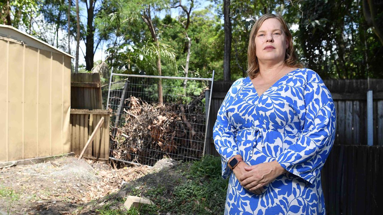 Arana Hills resident Jodie Davis has been forced out of her home after a tree from a neighbouring property crashed through the roof, triggering a dispute over who owns the tree. Picture: Patrick Woods.