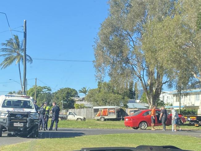 A red vehicle is towed from the scene of a traffic crash in Westcourt after colliding with a motorcycle. Picture: Supplied