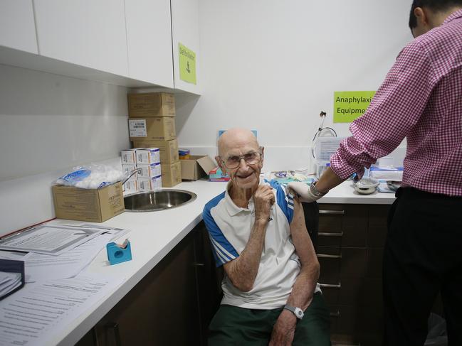 John Pearce receives the AastraZeneca vaccine from Dr Ethan An at the Sydney Road Family Medical Practice. Picture: Getty Images.