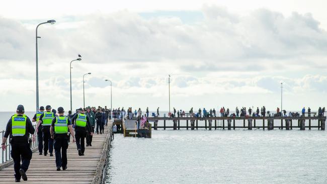 Police enforce the closure of Rye Pier on Victoria’s Mornington Peninsula. Picture: Mark Stewart