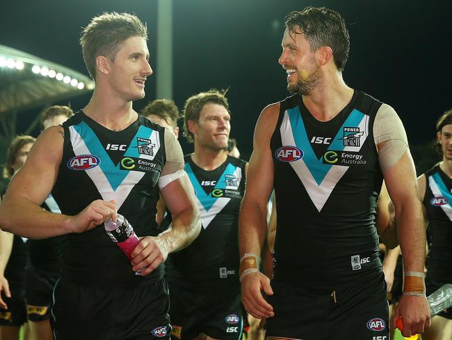 Hartlett all smiles with Port captain Travis Boak after a win at Adelaide Oval. Picture: Sarah Reed.